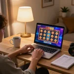 Person engaged in online gameplay at U888 casino on a laptop with strategic notes beside them.